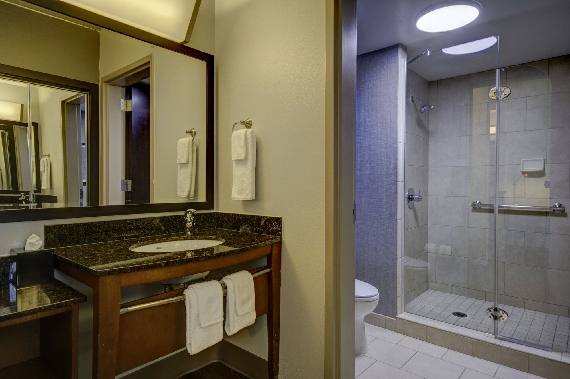 combined shower/bathtub, designer toiletries, hair dryer, towels