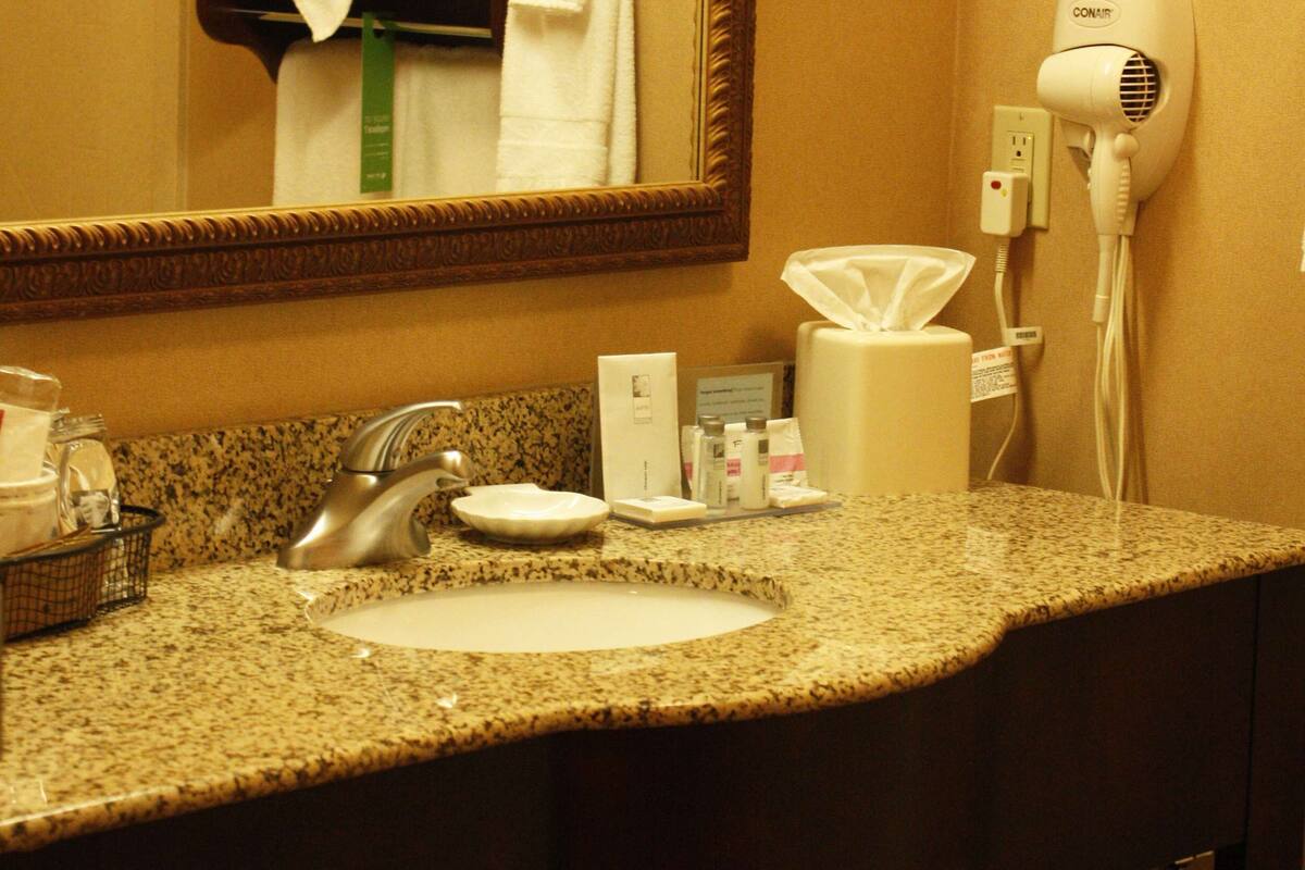 bathtub, hair dryer, towels