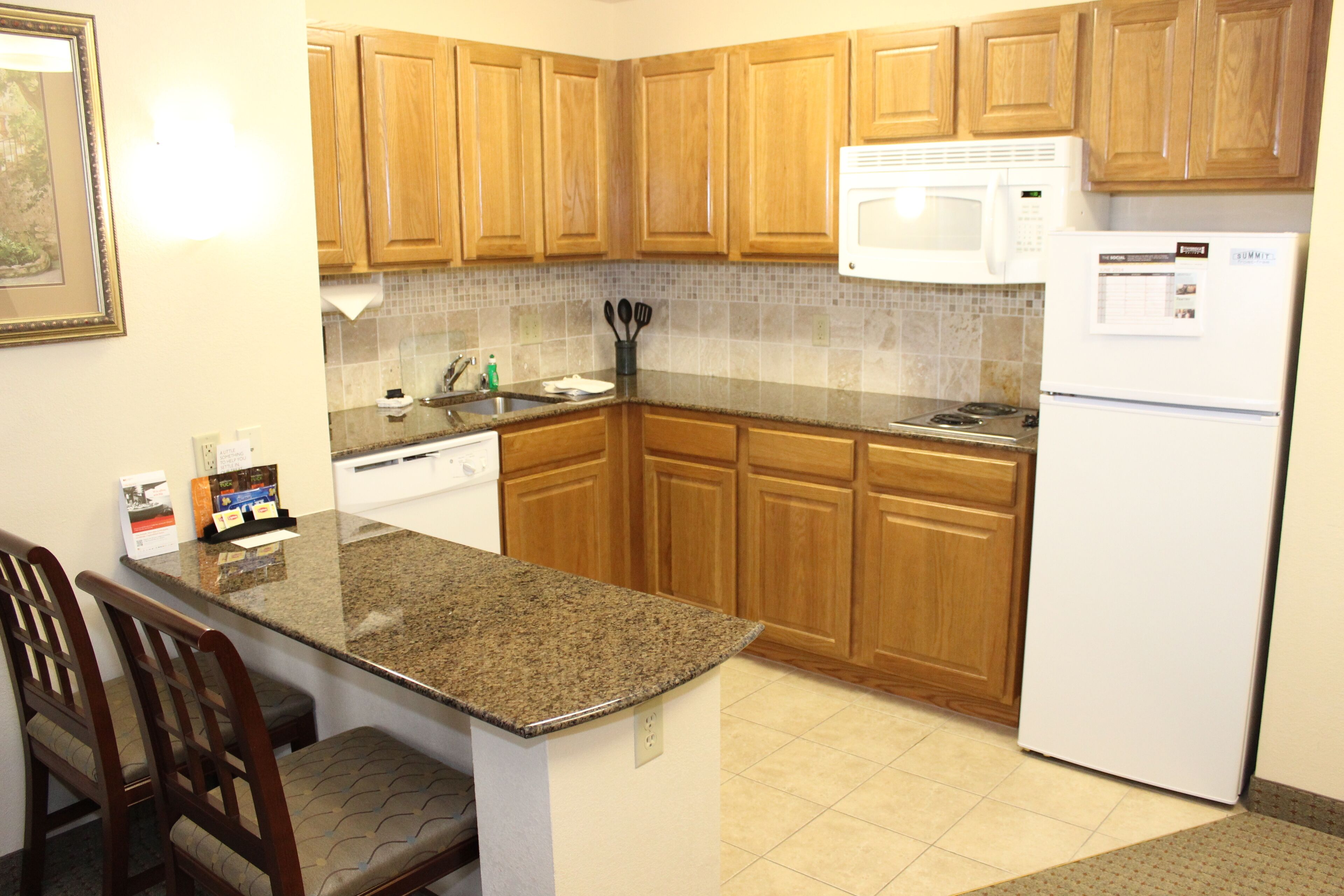 full-sized fridge, microwave, stovetop, dishwasher