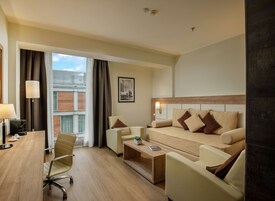 Standard Suite, Multiple Beds (with Separate Lounge Area) | Living area | 55-inch flat-screen TV with satellite channels, TV