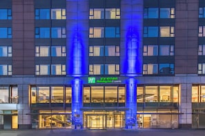 A hotel with a modern facade, large windows, and a prominent entrance with a glass door. - Holiday Inn Express Beijing Temple of Heaven by IHG (Beijing)