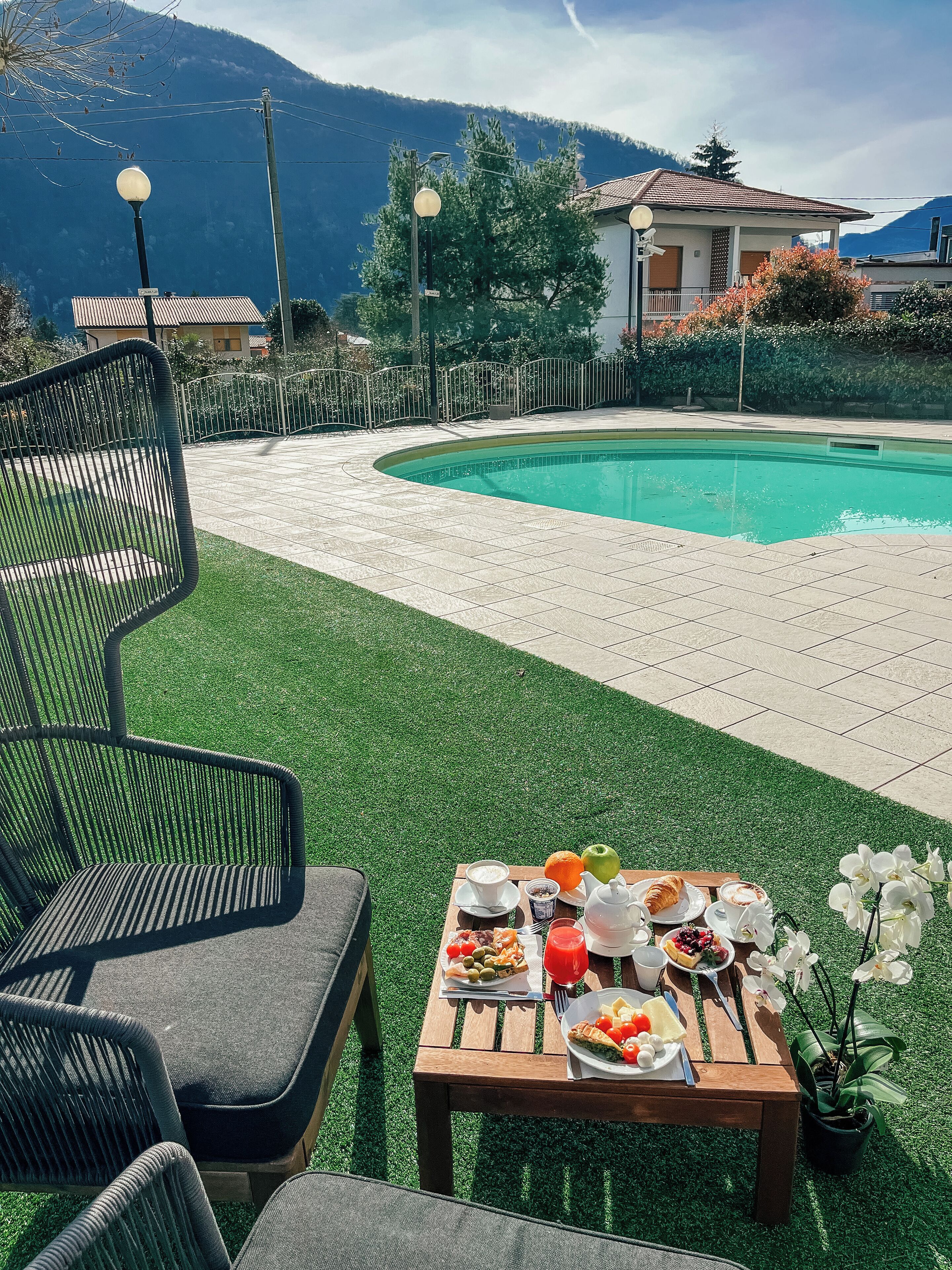 outdoor pool, open 8:00 am to midnight, pool umbrellas, pool loungers