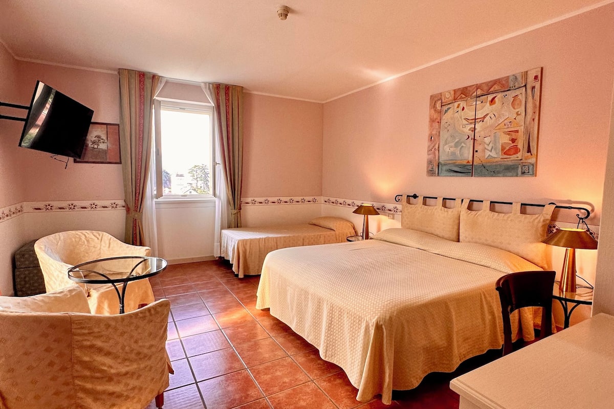 premium quadruple room | in-room safe, desk, blackout curtains, free wifi