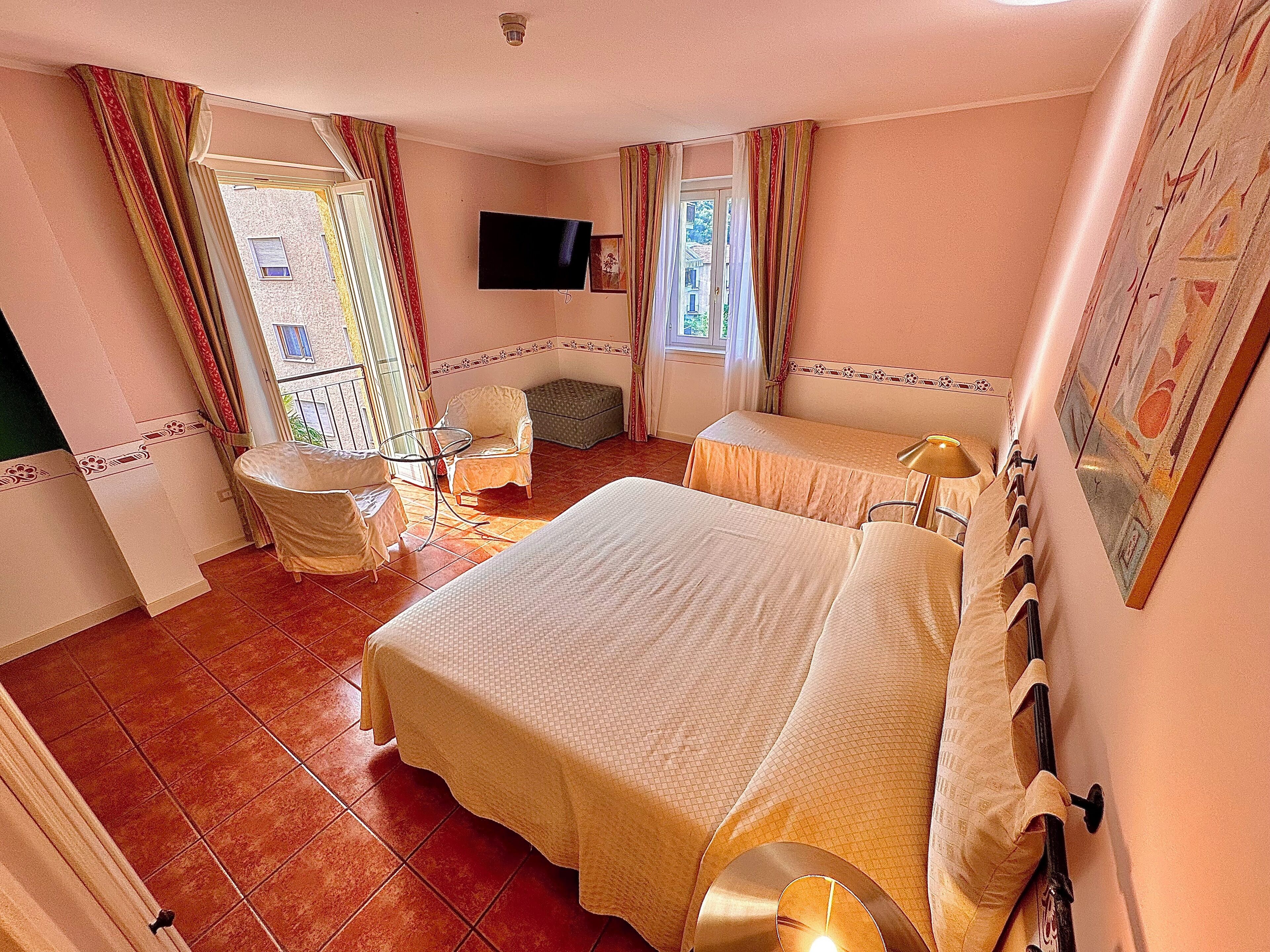 premium quadruple room | in-room safe, desk, blackout curtains, free wifi