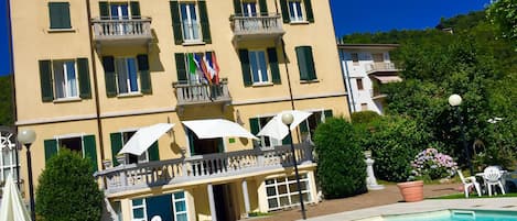 Outdoor pool, open 8:00 AM to midnight, pool umbrellas, pool loungers