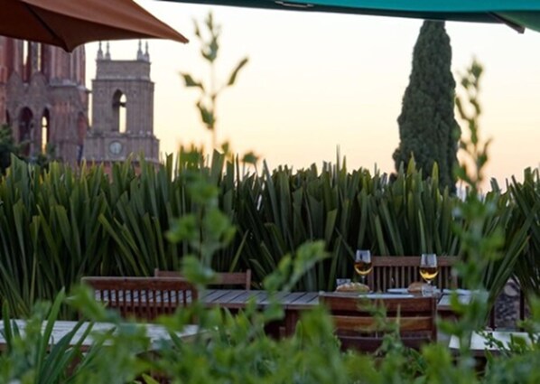 A table set for dining with a view of a historic building in the background.