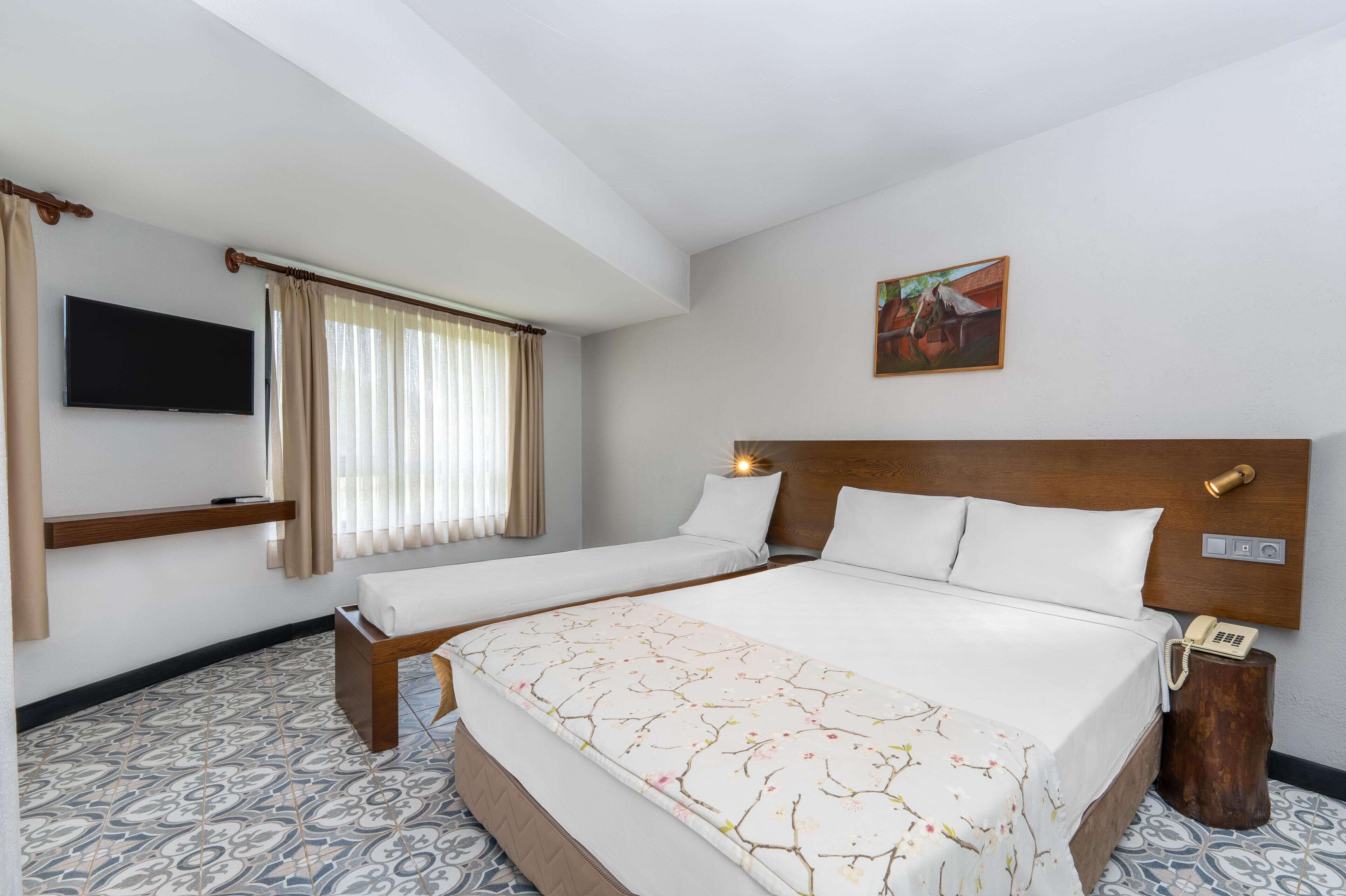 economy twin room, garden view | 1 bedroom, minibar, in-room safe, wifi