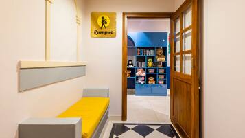 Enter the Rumpus room, featuring a cozy bed with a comfortable mattress and a stylish headboard.