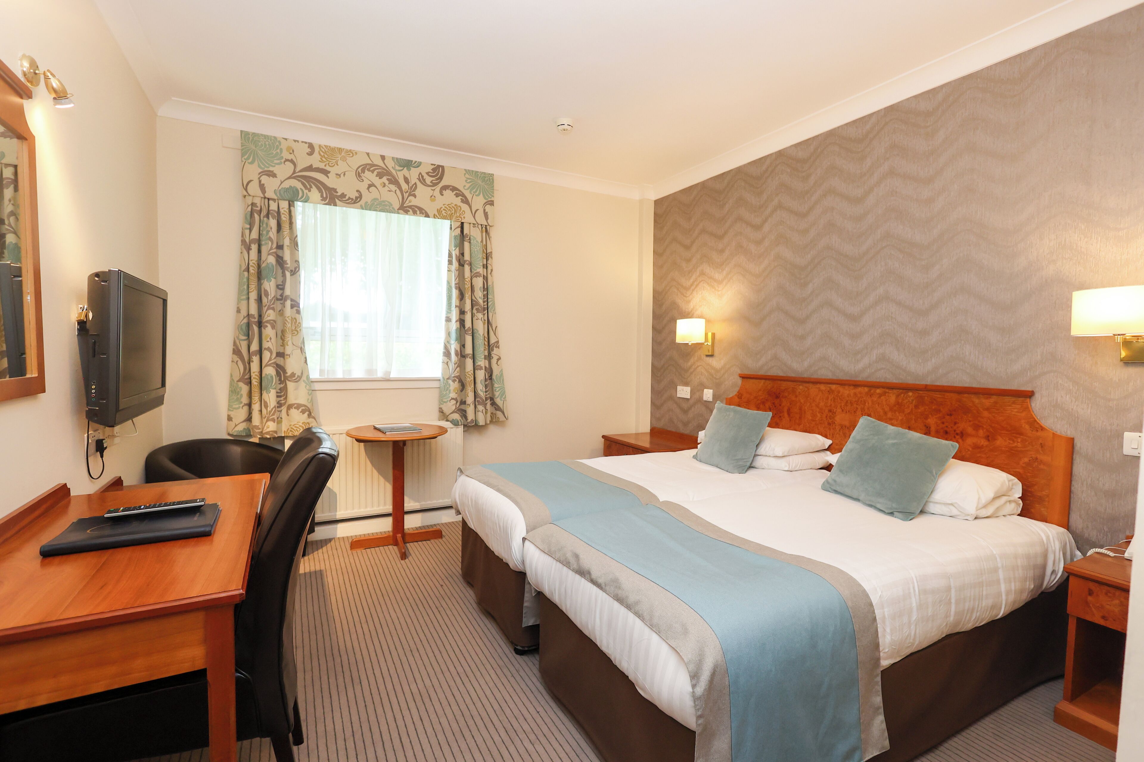 Hypo-allergenic bedding, desk, blackout drapes, iron/ironing board