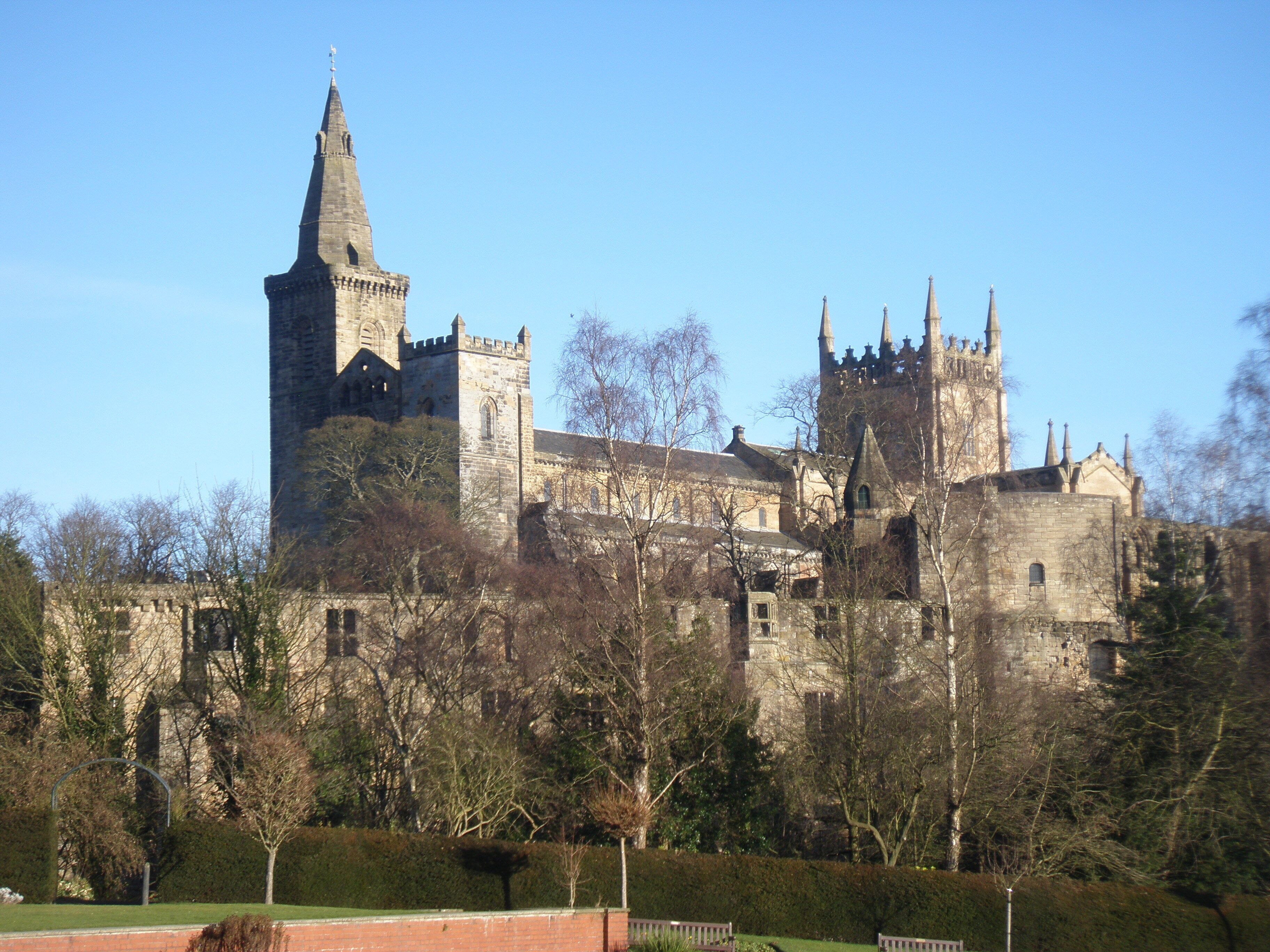 A historic castle with multiple towers and a prominent central tower.