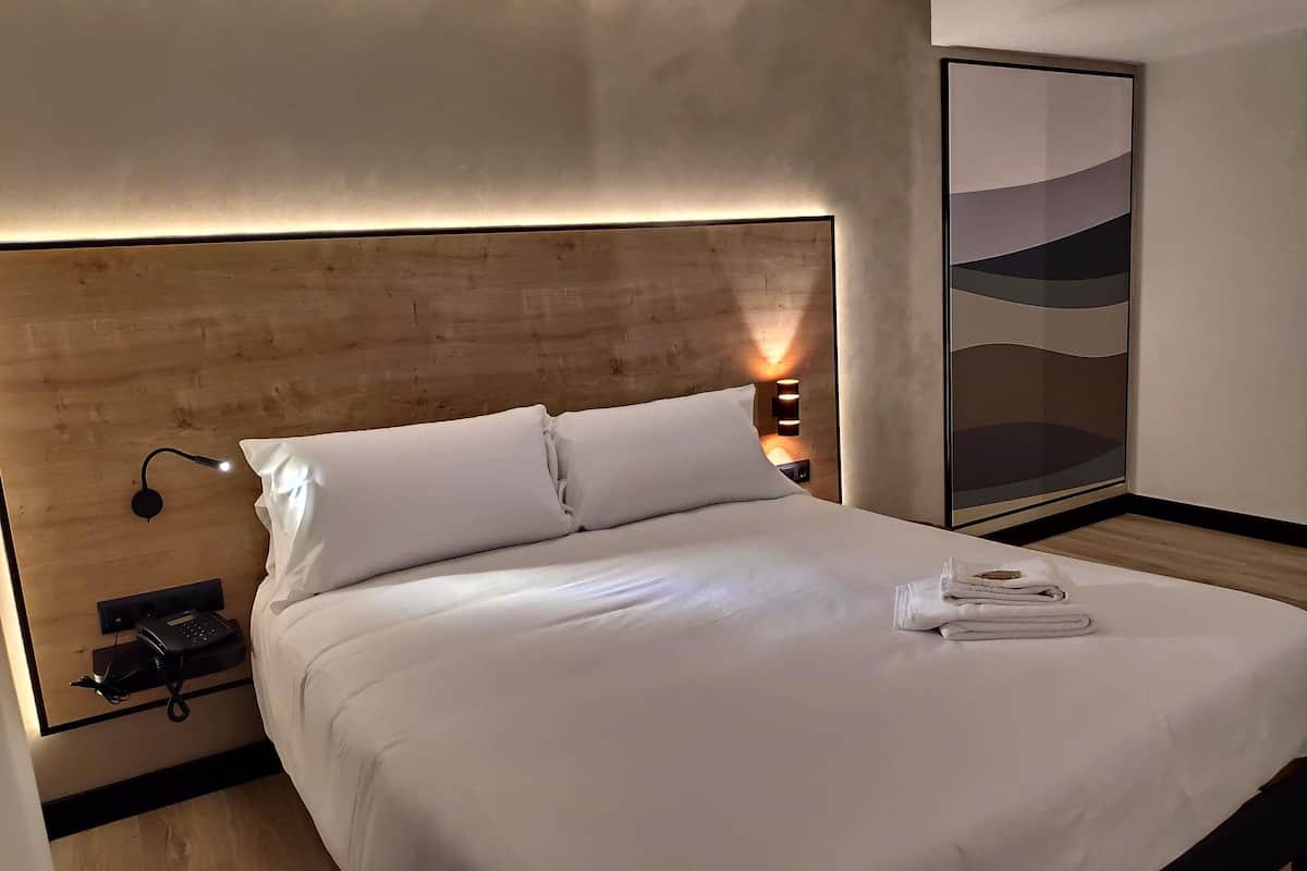 desk, laptop workspace, blackout curtains, iron/ironing board