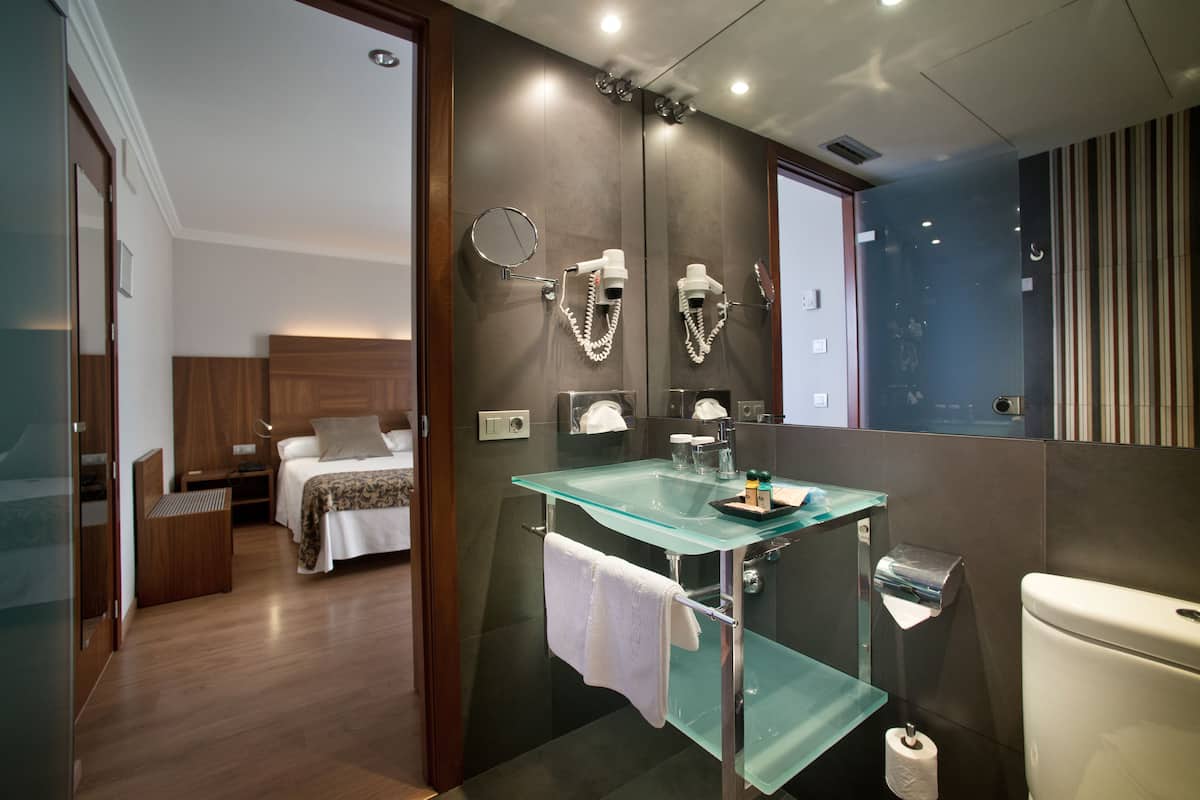 desk, laptop workspace, blackout curtains, iron/ironing board