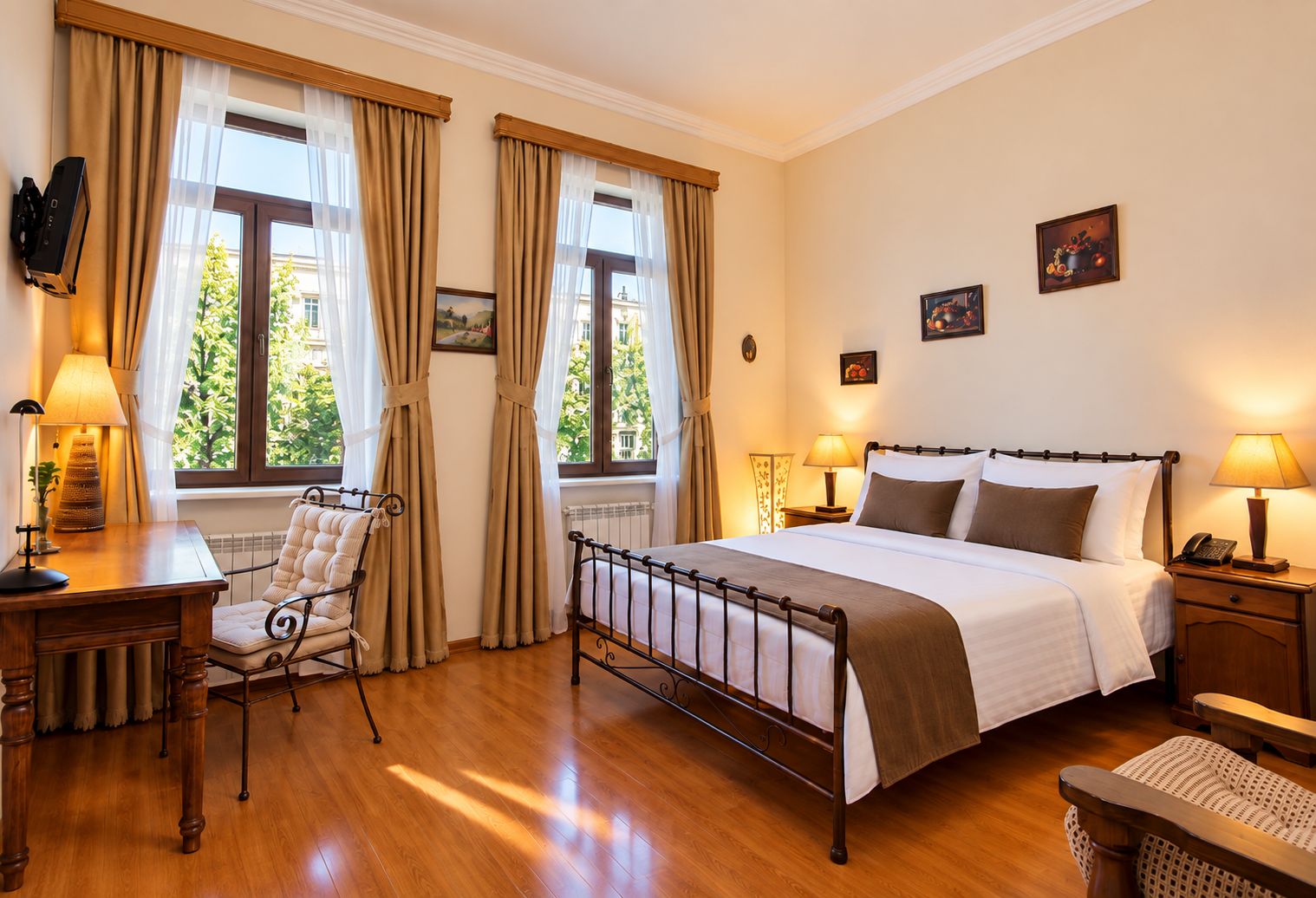 A hotel room with a bed, bedside tables, a chair, and a window with curtains.
