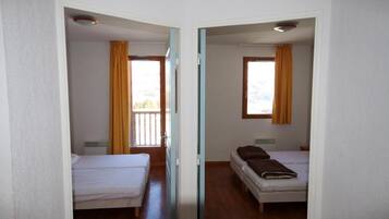 Blackout drapes, soundproofing, iron/ironing board