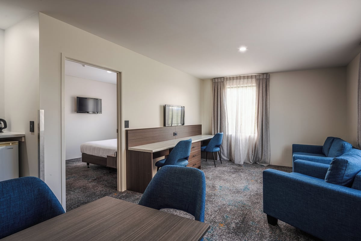 superior 1 bedroom king suite | desk, iron/ironing board, free wifi, bed sheets