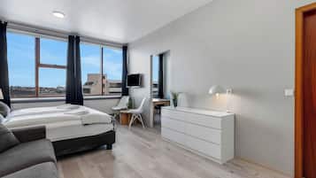 Family Studio, Partial Sea View | Living area | Flat-screen TV