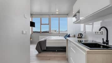 Economy Studio, 1 Queen Bed | Living area | Flat-screen TV