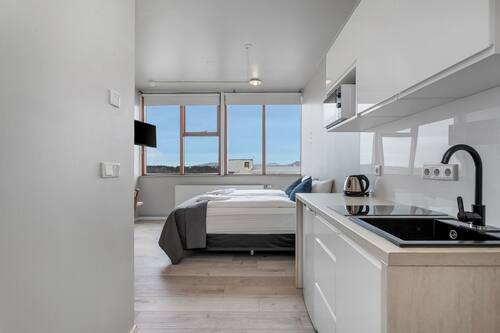 Estudio económico, 1 cama de matrimonio | Zona de estar | Una televisión de pantalla plana