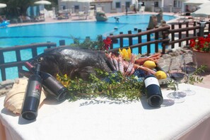 Savor a seafood feast by the pool.