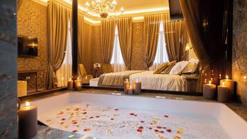 Relax in a serene oasis with a spacious bathtub, plush bed, and elegant decor.