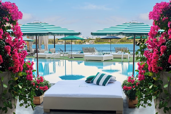Outdoor pool, open noon to 6:00 PM, cabanas (surcharge), pool umbrellas