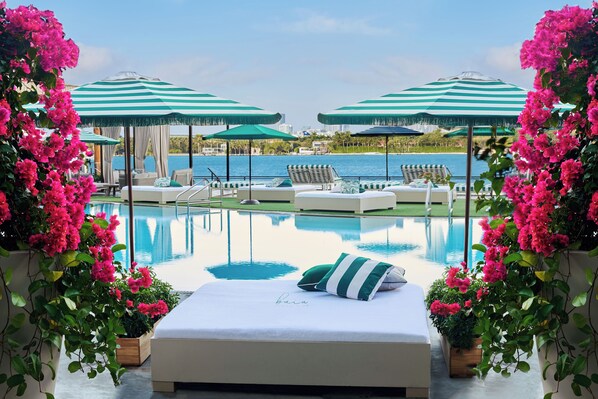 Outdoor pool, open noon to 6:00 PM, cabanas (surcharge), pool umbrellas