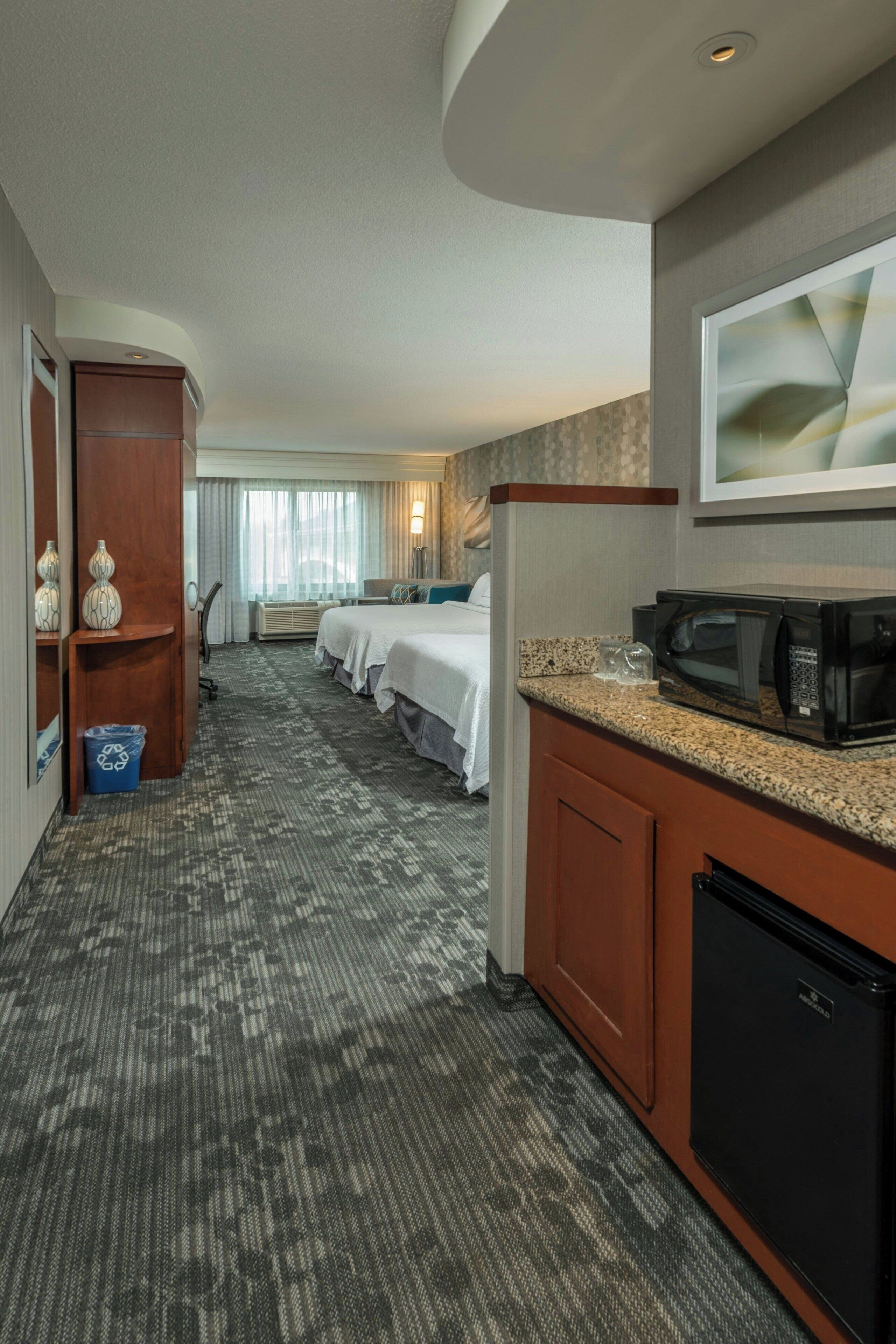 room, 2 queen beds | desk, laptop workspace, iron/ironing board, free cots/infant beds