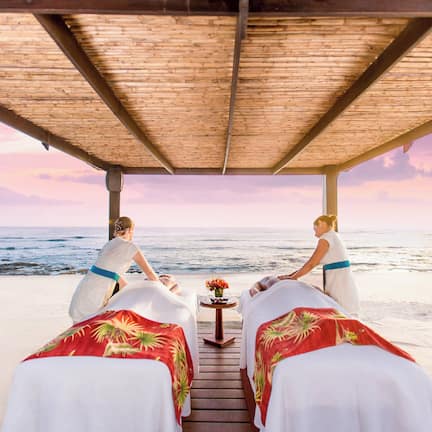 On the beach, white sand, free beach shuttle, beach cabanas