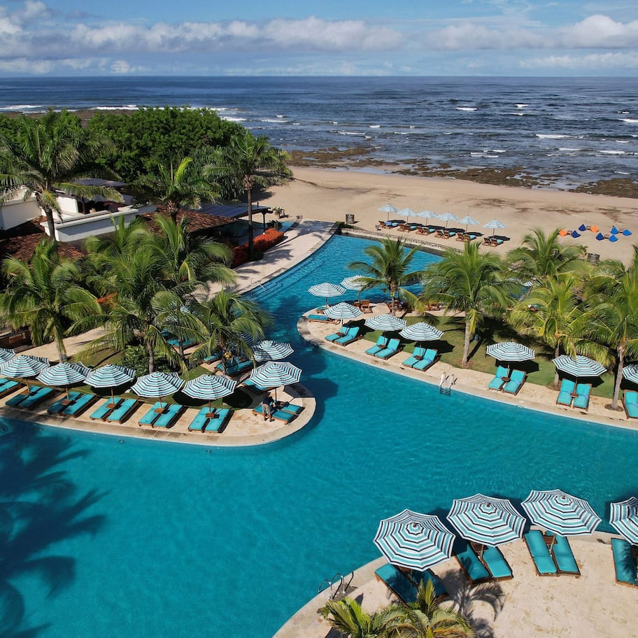 On the beach, white sand, free beach shuttle, beach cabanas