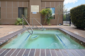 Relax by the pool, where a clear lane divider separates the water and a metal ladder provides easy access.