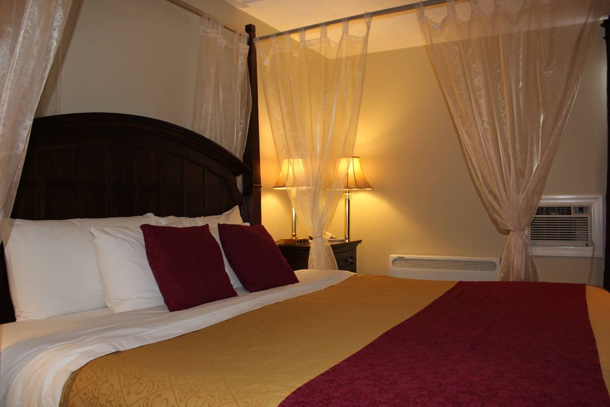 Room, 1 King Bed, Jetted Tub | Individually furnished, desk, laptop workspace, blackout drapes