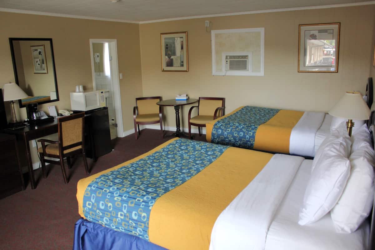 Room, 2 Queen Beds | Individually furnished, desk, laptop workspace, blackout drapes