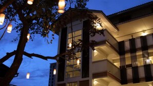 A modern building with multiple balconies and a pool area. - Nantra De Boutique (Pattaya)