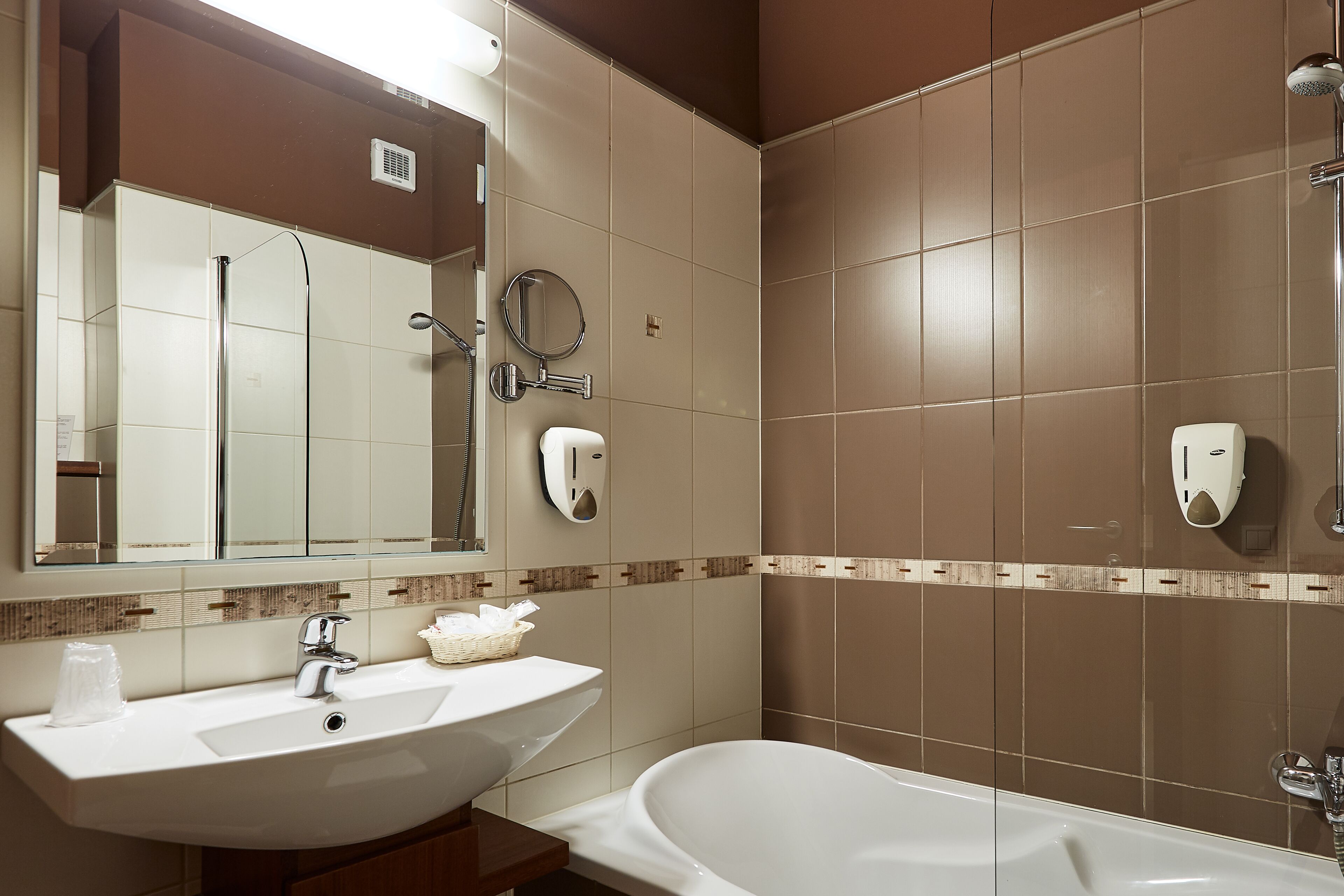 comfort suite | bathroom | hair dryer, bathrobes, slippers, towels