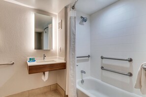 A bathroom with a sink, mirror, shower, and grab bars. - Holiday Inn Express & Suites, Lake Elsinore by IHG (Lake Elsinore)