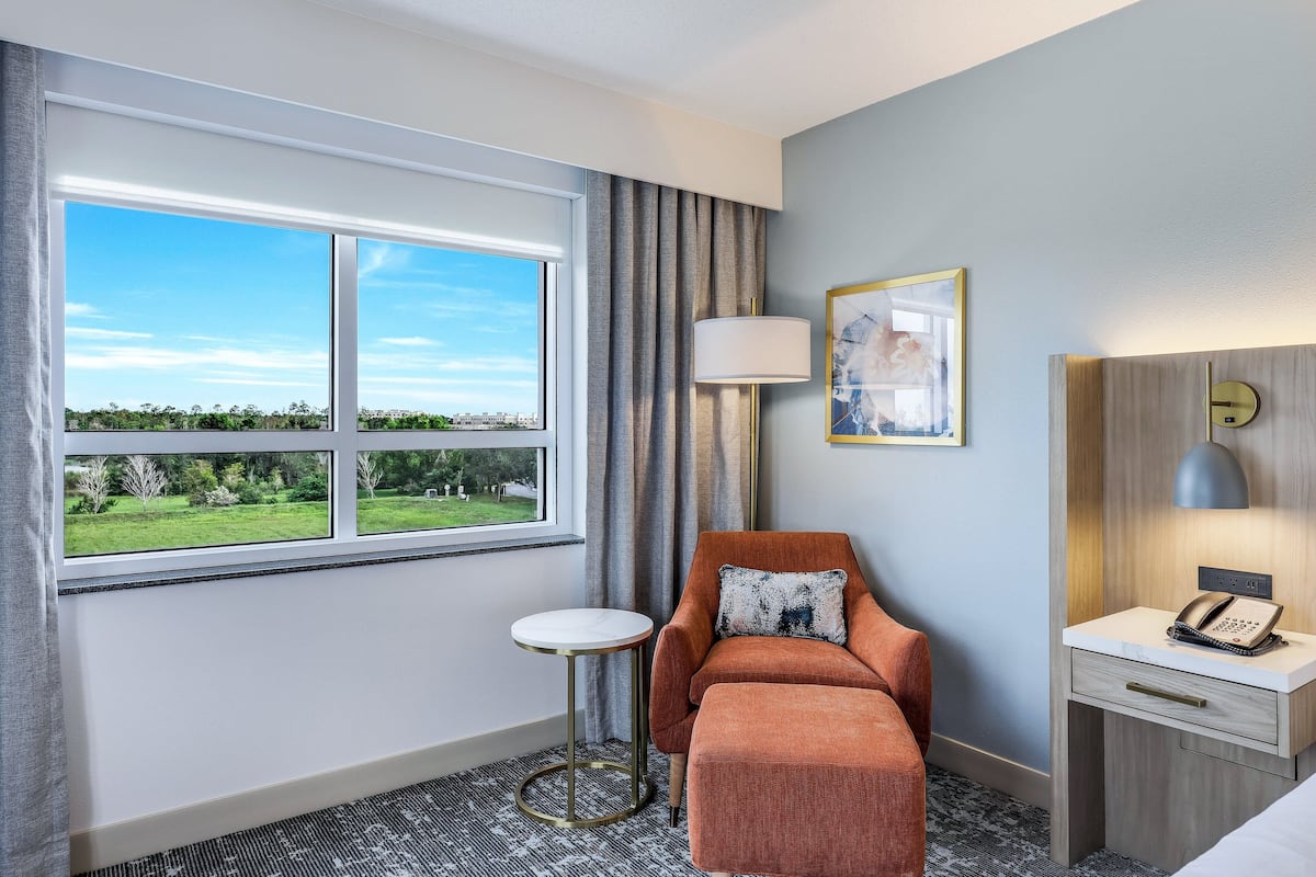 Premium bedding, desk, laptop workspace, blackout drapes