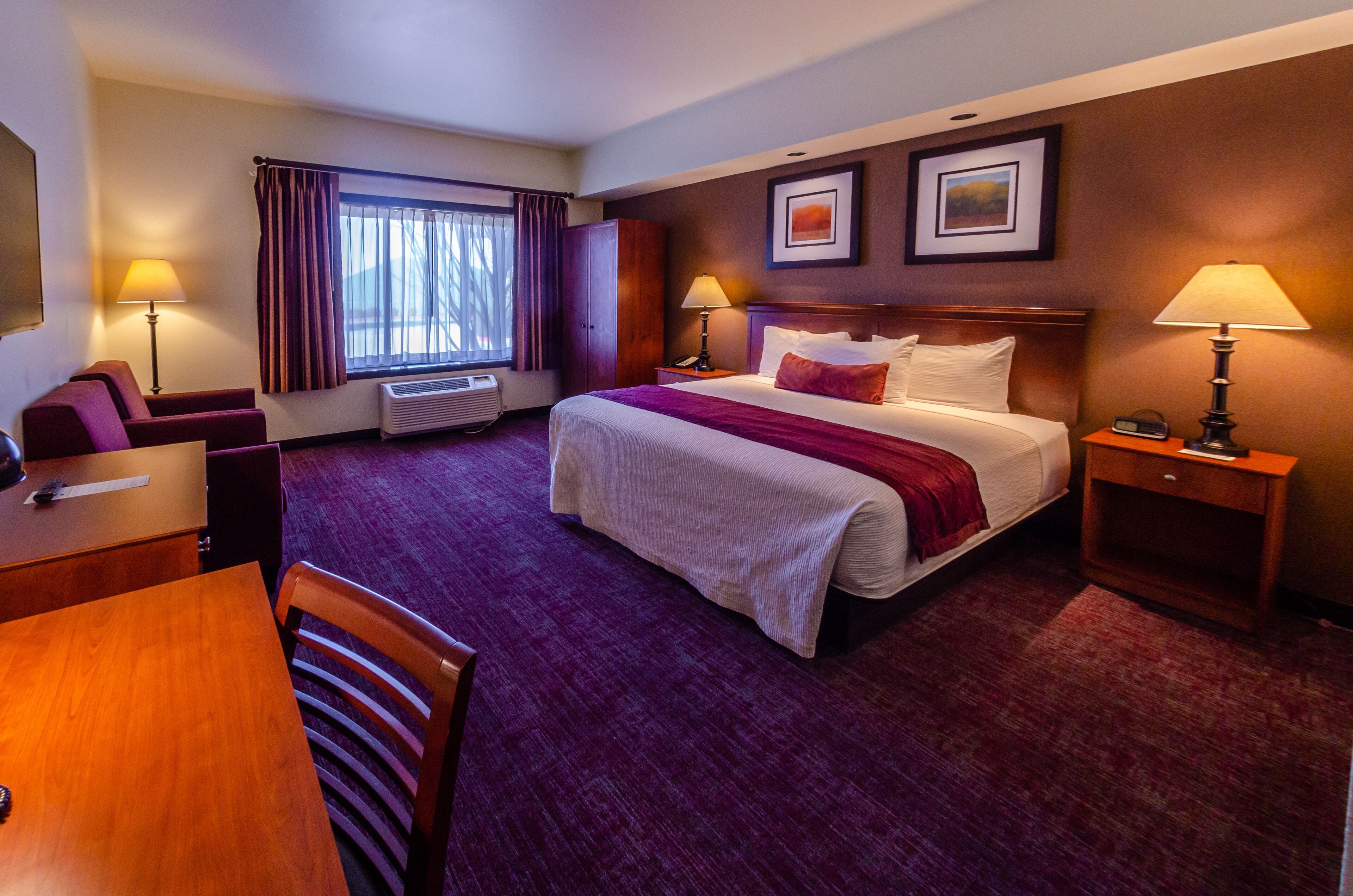 premium bedding, pillow-top beds, desk, laptop workspace