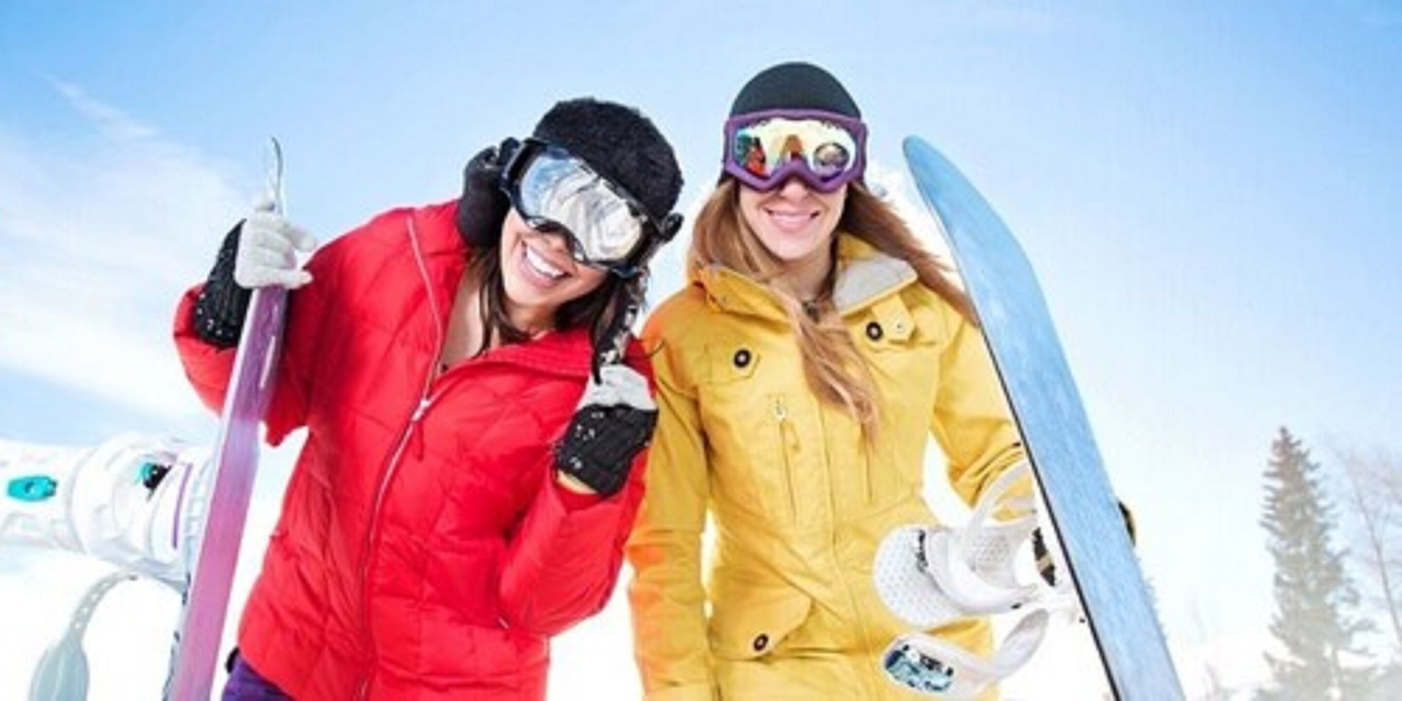 Two people in ski gear, one holding a ski pole and the other a snowboard, standing in a snowy landscape.