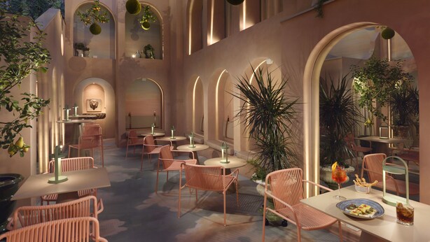 A cozy indoor patio with round tables and chairs, surrounded by arches and potted plants. - Leon's Place Hotel (Rome)