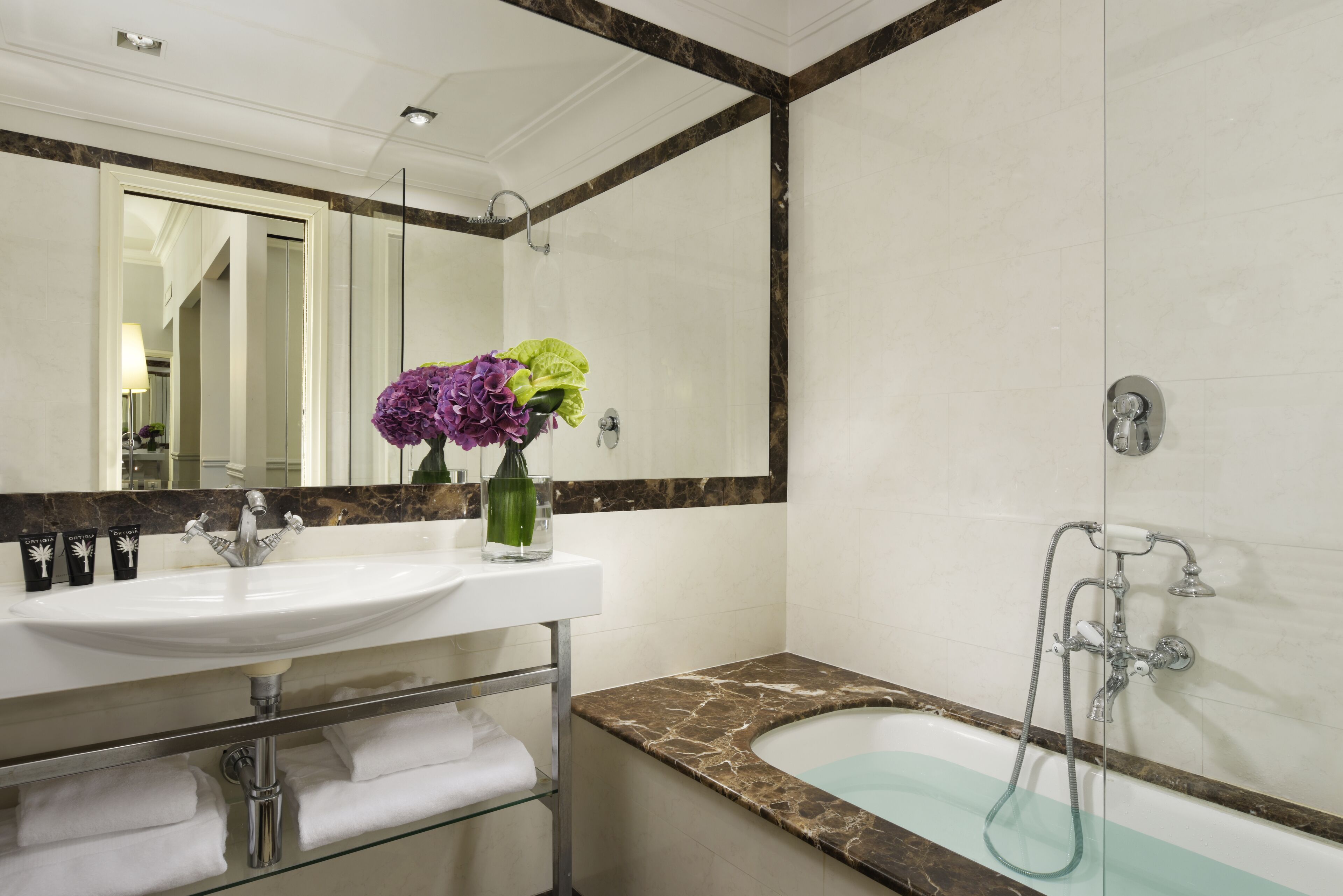 eco-friendly toiletries, hair dryer, slippers, towels