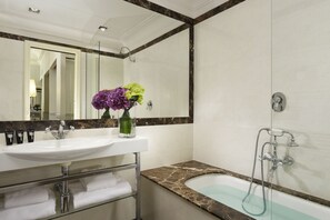 Eco-friendly toiletries, hair dryer, slippers, towels
