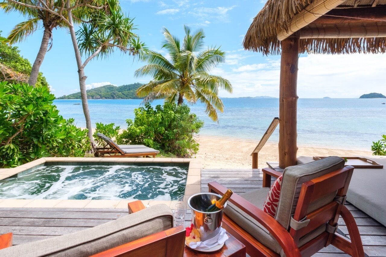 Deluxe Beachfront Bure | Egyptian cotton sheets, premium bedding, pillowtop beds, minibar