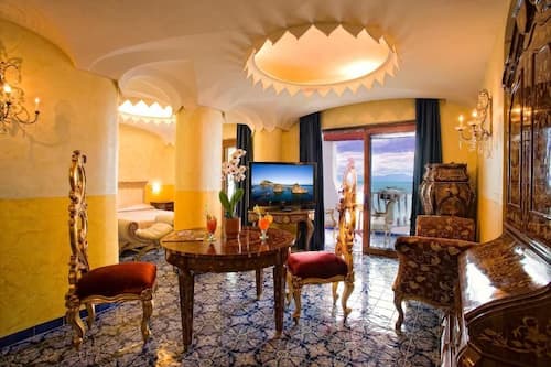 Deluxe Suite, Balcony | Minibar, in-room safe, desk, blackout curtains