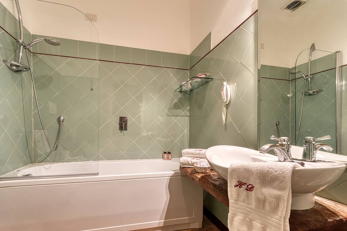superior double or twin room | bathroom | free toiletries, hair dryer, bidet, towels