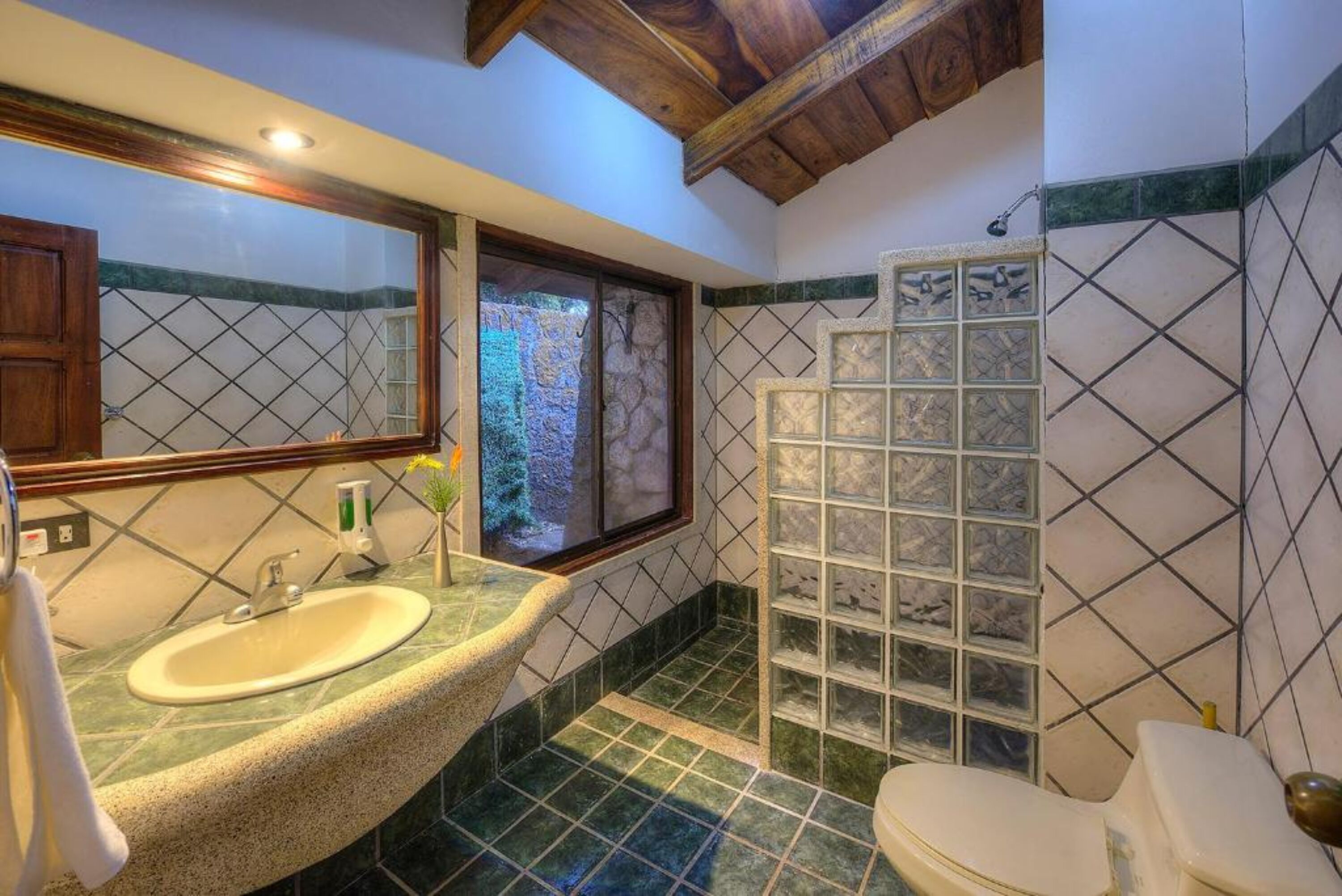suite | bathroom | shower, rainfall showerhead, eco-friendly toiletries, towels