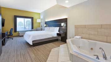 Suite, 1 très grand lit (Whirlpool) | 1 chambre, bureau, rideaux occultants, fer et planche à repasser