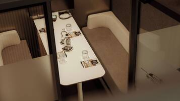 A conference room with a long table, several chairs, and informational brochures.