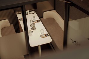 A conference room with a long table, several chairs, and informational brochures. - Van der Valk Hotel Rotterdam - Blijdorp (Rotterdam)