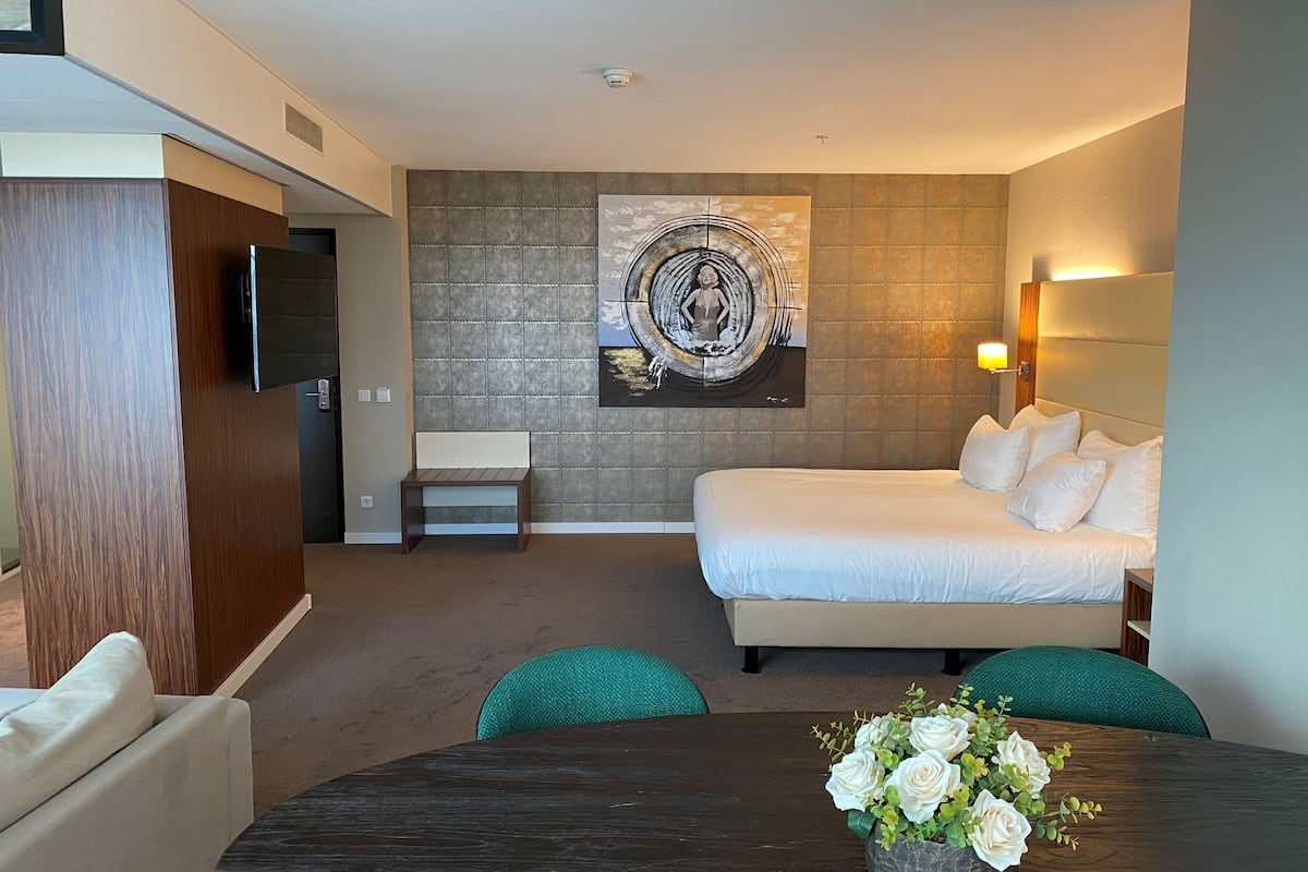 junior suite | 1 bedroom, in-room safe, desk, laptop workspace