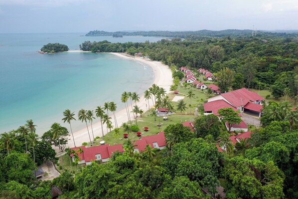 A resort with beach access, palm trees, and red-roofed buildings. - Mayang Sari Beach Resort (Bintan)